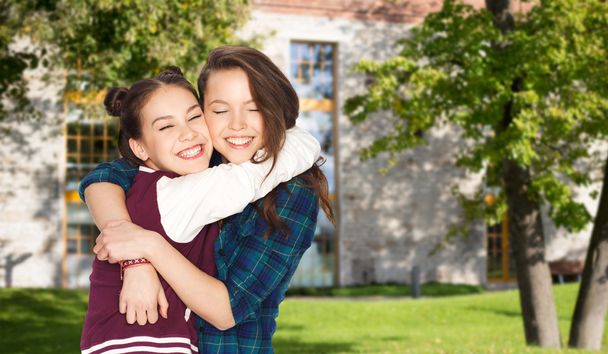 happy smiling pretty teenage student girls hugging - Fotoğraf, Görsel