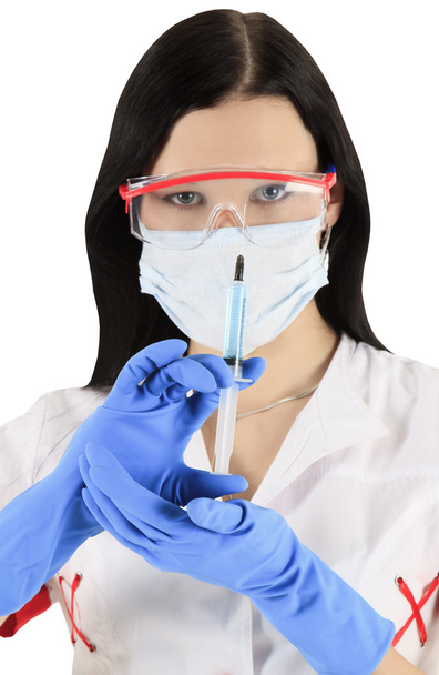 Young nurse in mask with syringe - Foto, Imagen