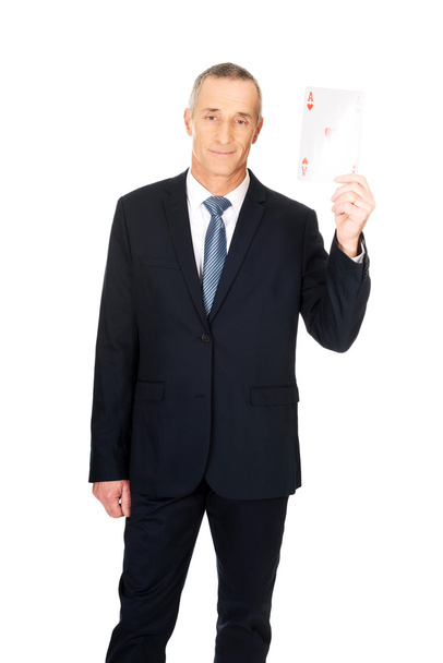Elegant business man with red ace card - Фото, зображення