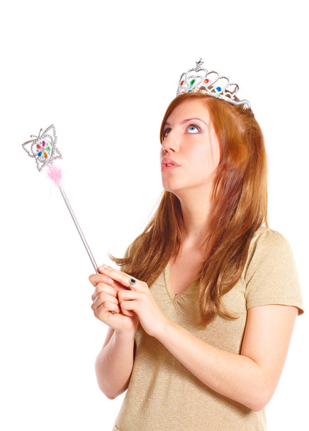 Attractive young woman holding a magic wand - Фото, зображення