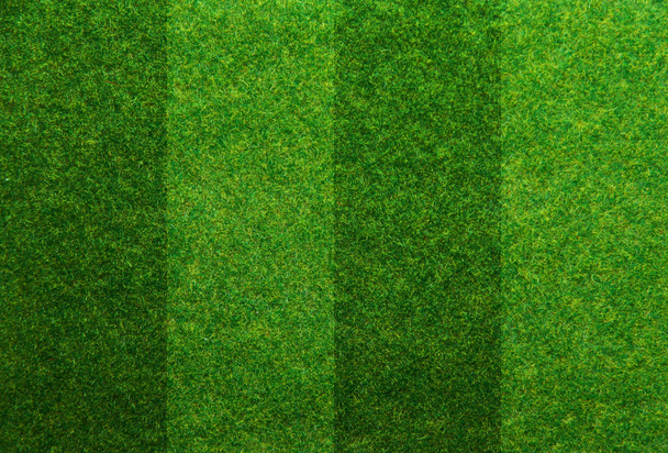 groen gras voetbalveld achtergrond - Foto, afbeelding