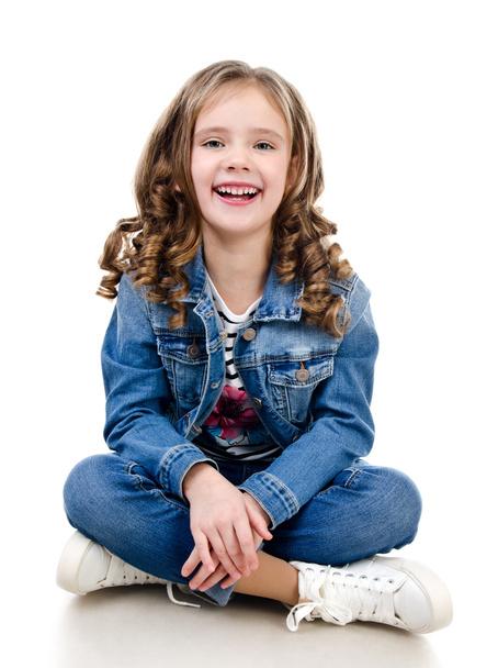 Cute smiling little girl sitting on the floor  - Fotografie, Obrázek