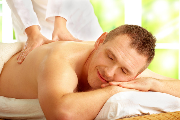 Male enjoying massage treatment - Valokuva, kuva