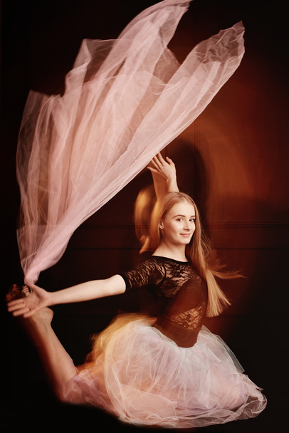 young beautiful dancer girl dancing and jumping, studio - Fotó, kép