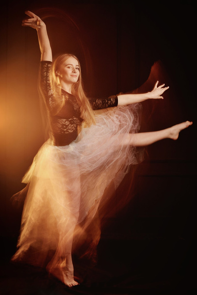 young beautiful dancer girl dancing and jumping, studio - Фото, зображення