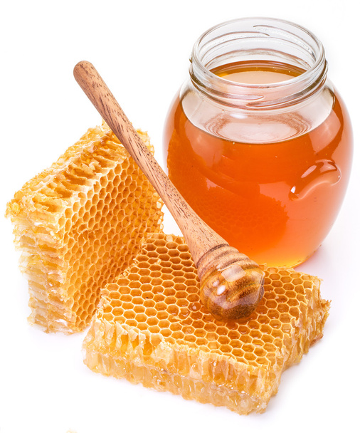 Jar full of fresh honey and honeycombs. High-quality picture. - Φωτογραφία, εικόνα