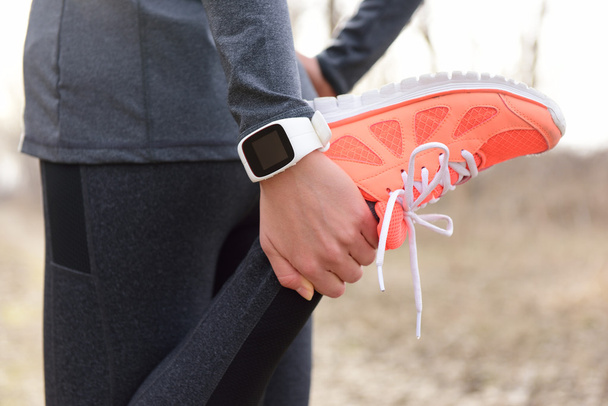 runner wearing smartwatch - Fotó, kép