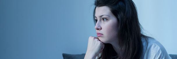 Pensive girl in melancholy mood - Fotó, kép