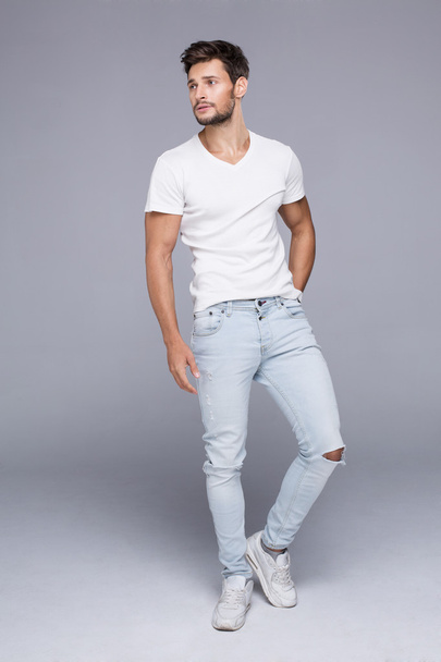 Handsome man posing in white t-shirt - Фото, зображення