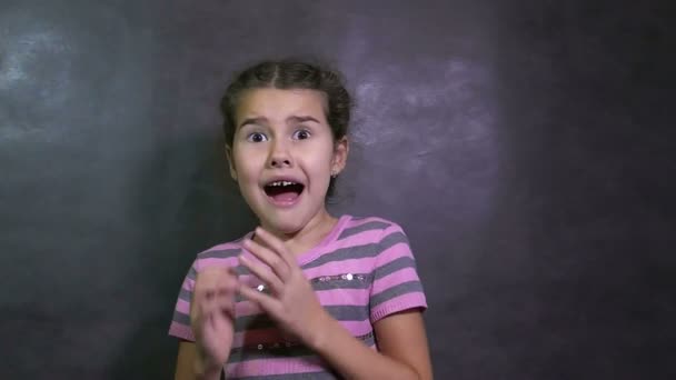 girl teen surprise fear of terror fright big eyes studio slow motion - Footage, Video