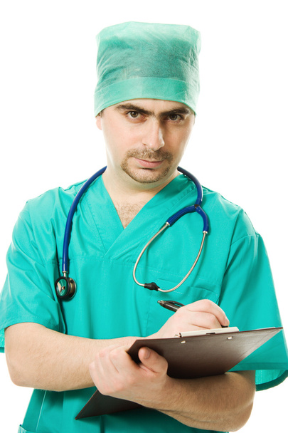 Male surgeon writes on the tablet - 写真・画像