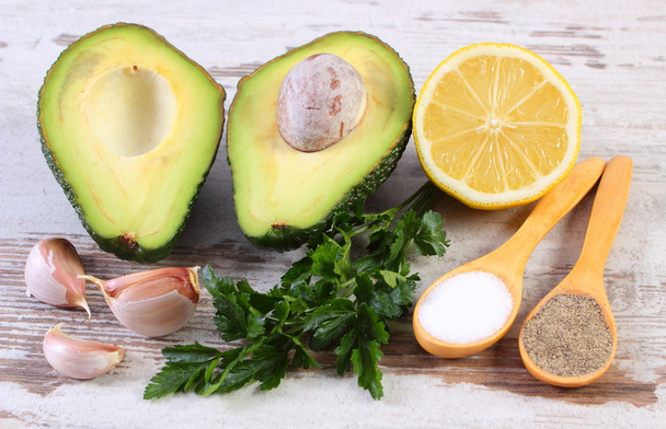 Avocado with ingredients and spices to avocado paste or guacamole, healthy food and nutrition - Фото, изображение