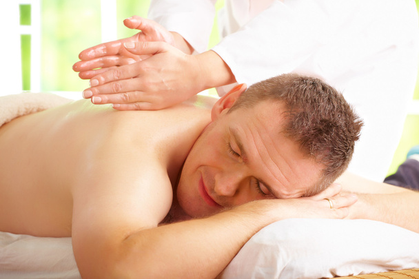 Man enjoying massage treatment - Photo, Image