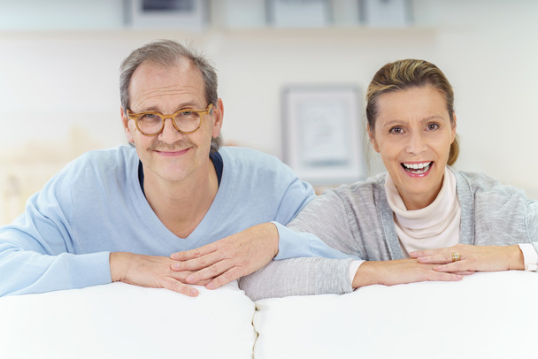 smiling middle aged couple at home - Foto, Imagen