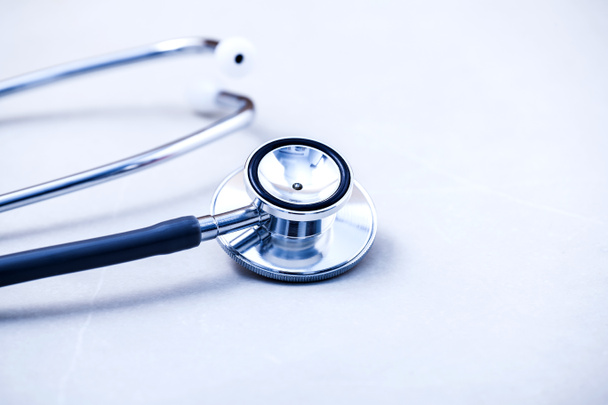 Stethoscope on white table with shallow depth of field - Photo, Image