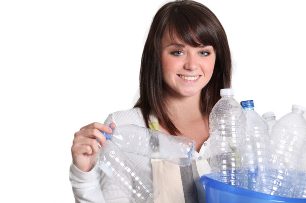 Woman gathering plastic bottles - Foto, immagini