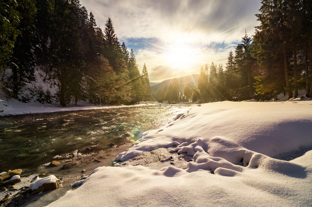 frozen river in forest at sunset - Photo, Image