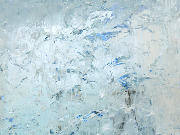 Glacial transparent block of ice with patterns. - Valokuva, kuva