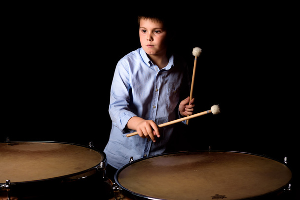Little drummer with drumsticks - Φωτογραφία, εικόνα