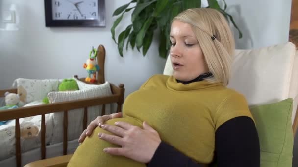 Mother feeling  that the baby  moving - Video