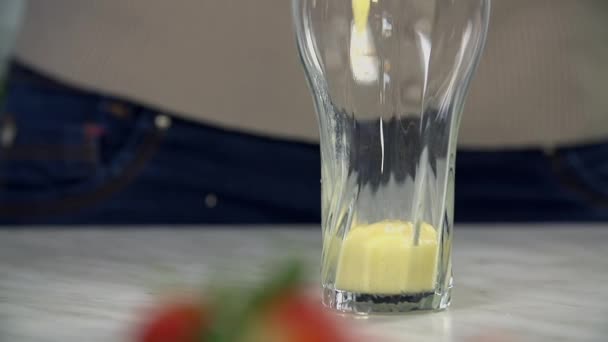 Pouring delicious healthy banana shake - Imágenes, Vídeo