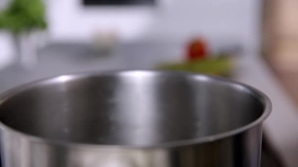 woman Putting pasta in the pot - Footage, Video
