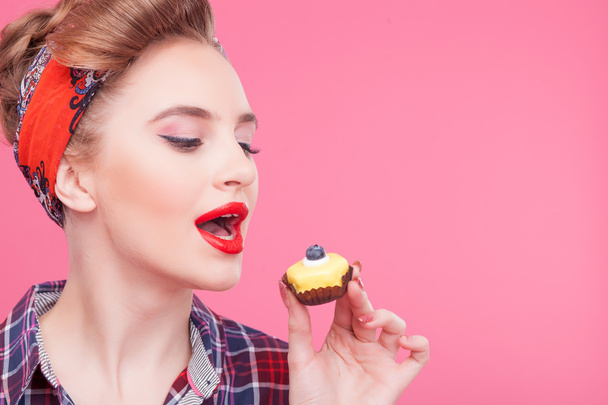 Pretty healthy girl is tasting sweet cake - Fotografie, Obrázek