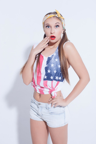 Beautiful young American woman is expressing surprise - 写真・画像