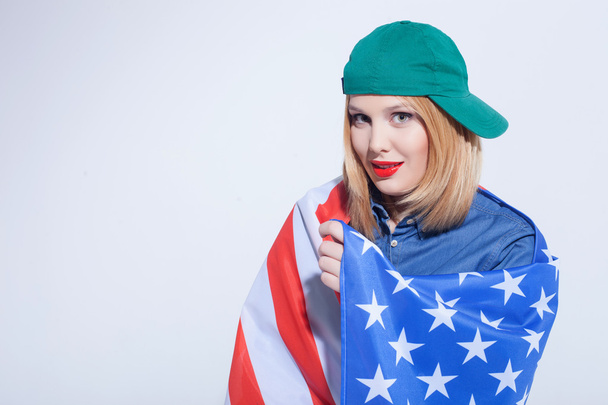 Cheerful American girl is expressing positive emotions - Foto, afbeelding