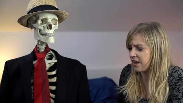woman is afraid  of  skeleton - Footage, Video