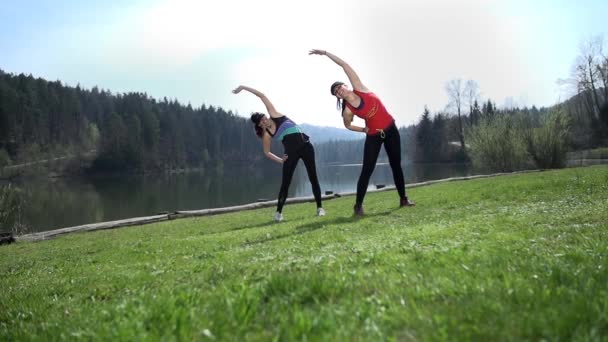 women  warming up and exercising - Materiał filmowy, wideo