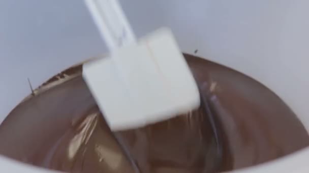 Chocolate being melted in a plastic bowl - Footage, Video
