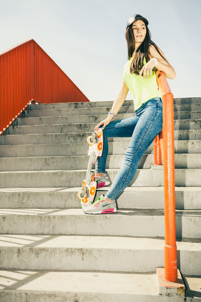 Girl on stairs with skateboard. - Fotoğraf, Görsel