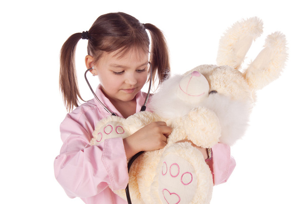 Girl, a doctor, the child, rabbit toy - Фото, изображение