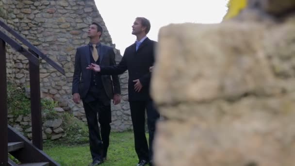 Business partners among the ruins of the castle - Footage, Video