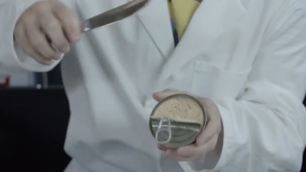 Open the can and puting pate on a bread - Footage, Video