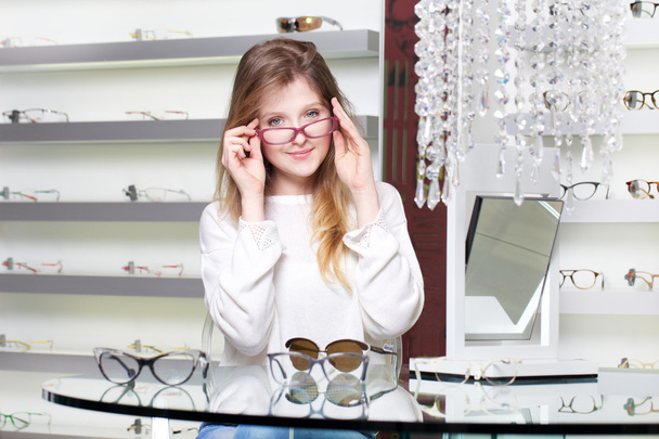 young woman in optical store - Photo, image