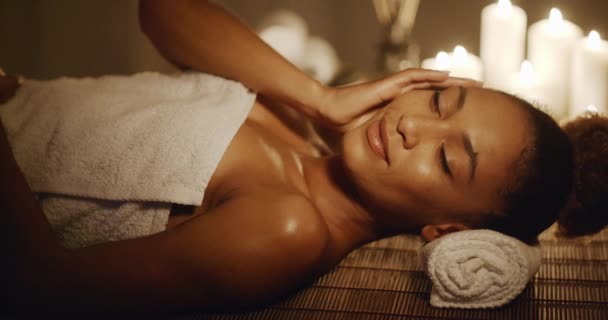 woman lying on massage table in towel - Video, Çekim