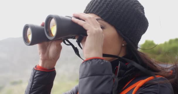 woman enjoying misty hike in mountains - Materiał filmowy, wideo
