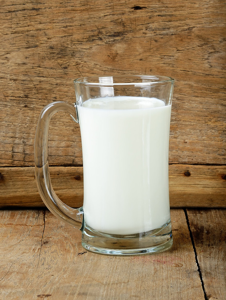 Glass with milk on the wooden background - Photo, Image