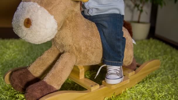 Plush rocking horse who is ride by cute child - Footage, Video