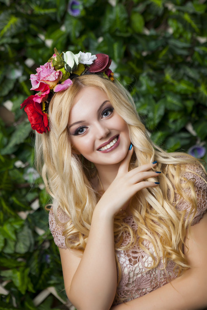Cute smiling blond girl with circlet from flowers - Fotoğraf, Görsel