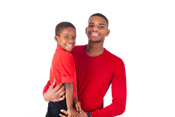 Afrikkalainen amerikkalainen mies pitää hänen pieni poikansa eristetty wh
 - Valokuva, kuva