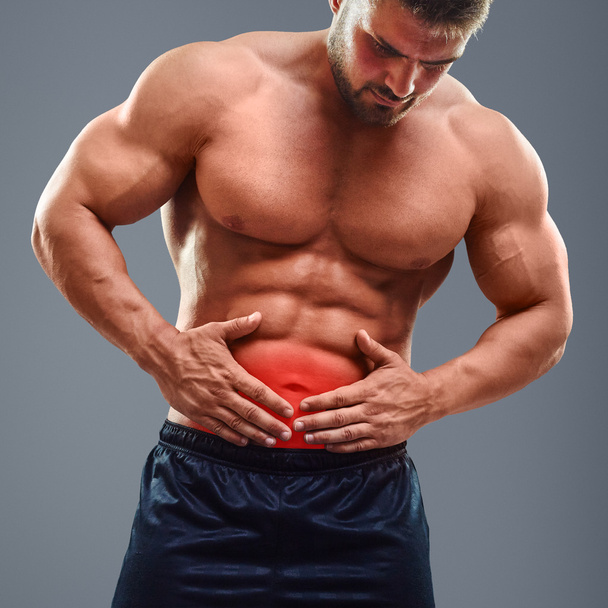 Ahtletic muscle man Stomach ache - Fotó, kép