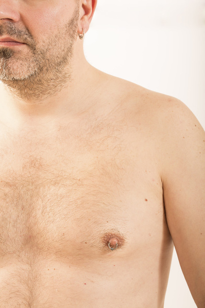 man with nipple piercing - Fotoğraf, Görsel