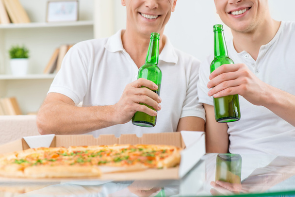 Father and adult son drinking beer - Photo, image