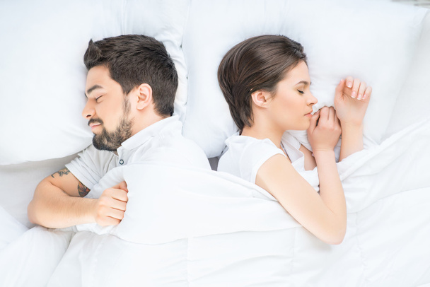 Nice loving couple lying in bed - Foto, Imagen