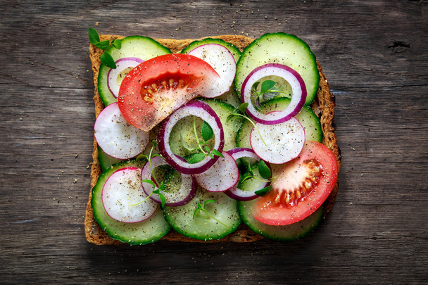 Vegetarian toast, sandwich with vegetables top view - 写真・画像