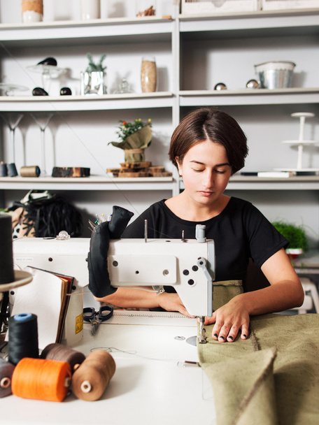 seamstress making clothes. Workplace of  tailor - Zdjęcie, obraz