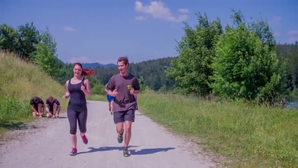 man an woman are running together - Felvétel, videó